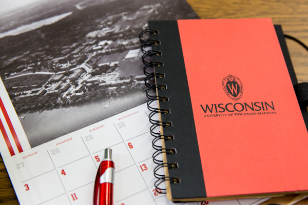 Course planning on a calendar and notebook