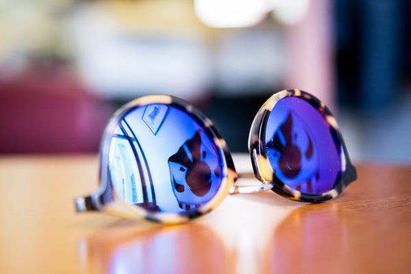 Sunglasses with Bucky Badger reflection